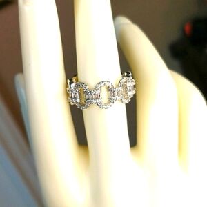 Two cubic zirconia rings size 8 & 8.5 both marked 925.